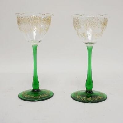 1100	PAIR OF GOLD ENAMELED GOBLETS W/GREEN BASES, TOPS ARE RUFFLED, 6 5/5 IN HIGH

