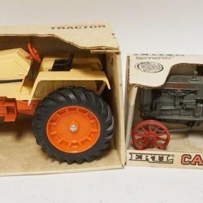 1311	2 ERTL CASE TRACTORS IN BOXES, LARGEST IS 9 IN LONG
