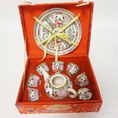1248	MINIATURE ASIAN TEA SET IN A FABRIC COVERED BOX, BOX IS 7 5/8 IN X 6 1/8 IN X 3 IN HIGH

