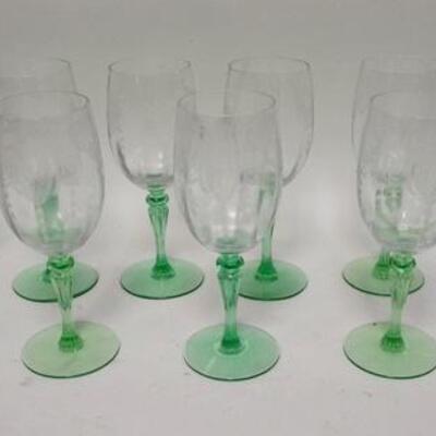 1285	13 ETCHED GOBLETS W/ GREEN FLUTED STEMS HAVE A MEDALLION OF A DANCING NUDE, 5 3/4 IN H ONE HAS A PIN HEAD NICK ON THE INSIDE RIM
