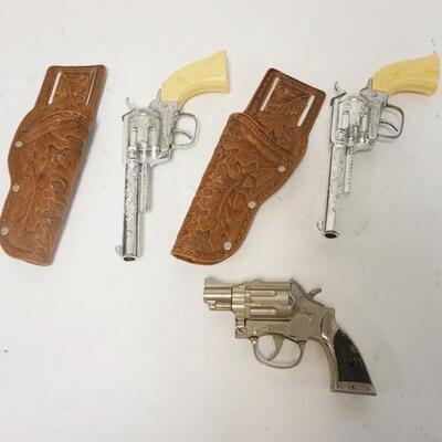 1310	3 CAP GUNS, PAIR OF PONY BOY W/LEATHER HOLSTERS & TROOPER, LARGEST IS 9 1/2 IN

