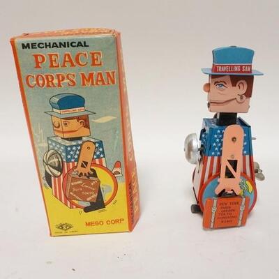 1313	MEGO MECHANICAL PEACE CORPS MAN, TIN WIND UP IN ORIGINAL BOX
