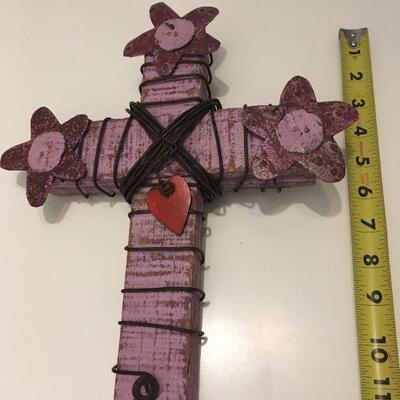 Wooden and metal cross in purple