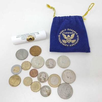 #314 â€¢ Foreign Currency And A Roll Of Philadelphia Mint Nickels
