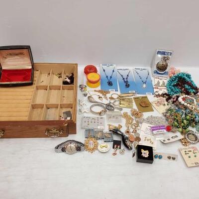 1692	

Jewlery Box With Costume Jewlery
Includes Necklaces, Pendants, Pins, Keychains, Pocket Watches And More!