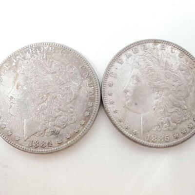 1711	

2 1884-P And 1885-P Morgan Silver Dollars
Both Philadelphia Mint Morgan Silver Dollars