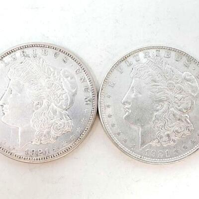 #1718 â€¢ 2 1921 Morgan Silver Dollars
 Philadelphia and Denver Mints. 