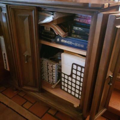 an old tv cabinet that does not have the tv anymore. The doors open and bifold to each side