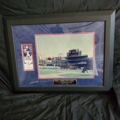 Picture and ticket illustrating Rafael Palmeiro 500th Home run, framed and signed by baseball first baseman.  for Texas Rangers.
 