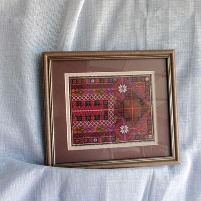 Crafted woven material framed by Artist size colors.