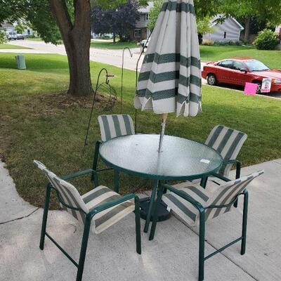 Patio table with 4 chairs and umbrella with stand