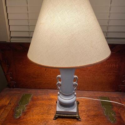 Lovely vintage blue ceramic lamp with brass accents. In excellent condition. 