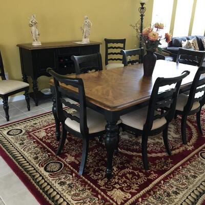 Dining Table & 8 chairs, 42â€ W x 68â€ L plus 18â€ leaf (86â€ L w/ leaf installed) x 30â€ H