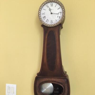 Large Howard Miller  pendulum wall clock, works & chimes beautifully