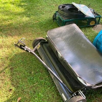 Lawn sweeper and a cart