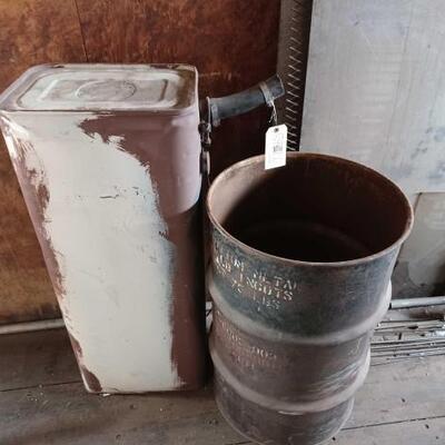 #8910 â€¢ Gasoline Tank And Metal Barrel With Car Parts