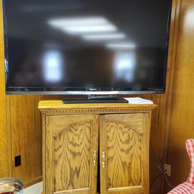 Big screen tv & oak cabinet