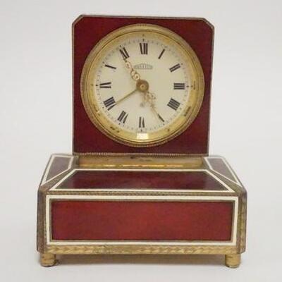 1058	ANGELUS ENAMELED CLOCK W/MUSIC BOX, MUSIC BOX NOT WORKING, 3 3/8 IN WIDE X 4 IN HIGH
