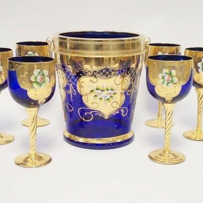 1036	7 PIECE ITALIAN BLOWN GLASS GOBLETS & ICE BUCKET, COBALT BLUE W/GOLD TRIM & APPLIED PORCELAIN, ICE BUCKET HAS A METAL RIM...