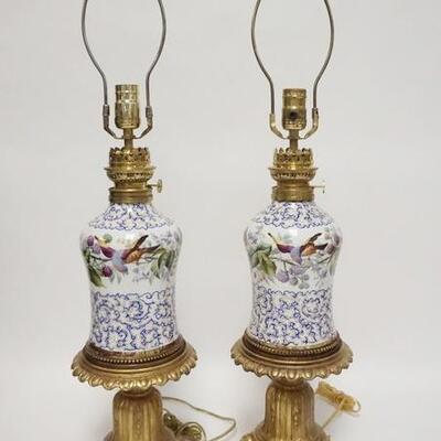 1077	PAIR OF HAND PAINTED PORCELAIN LAMPS, HAVE BEEN ELECTRIFIED, WICK TURNERS MARKED FRANCE, CORDS HAVE BEEN CUT, 29 3/4 IN HIGH
