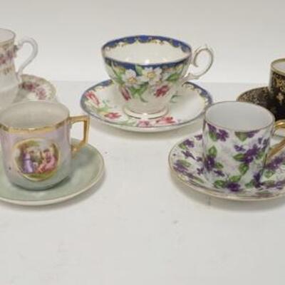 1233	GROUP OF 8 DECORATED CUP & SAUCER SETS
