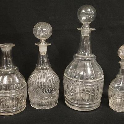 1140	4 MOLD BLOWN DECANTERS, 3 HAVE HOLLOW BLOWN STOPPERS, ROUGH PONTILS, TALLEST IS 11 1/4 IN

