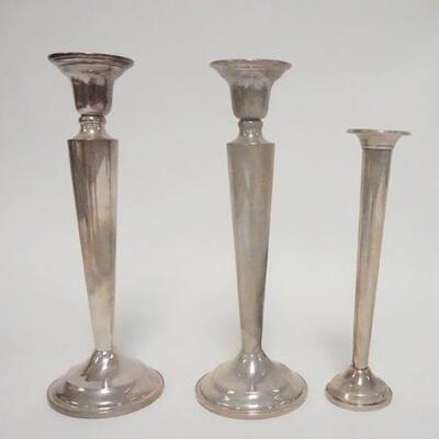 1027	3 PIECE WEIGHTED STERLING SILVER, CANDLESTICKS & BUD VASE, STICKS ARE 7 1/8 IN HIGH
