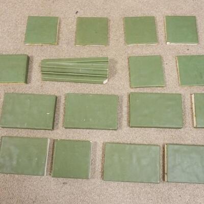 1265	LOT OF GREEN ART POTTERY TILES BY MANTEL, 17 PIECES
