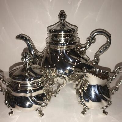 Creamer & Sugar  are 835 Silver and                                                         tea pot is silver over copper  and porcelain...