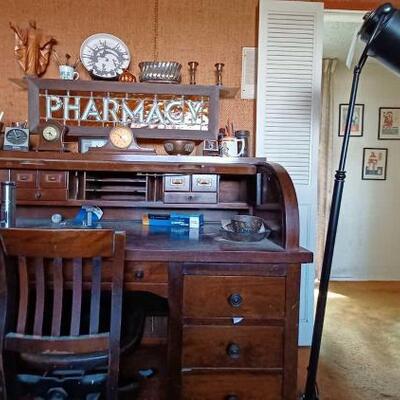 #1700 â€¢ Wooden Desk, Wooden Chair, Wall Decor, Three Clocks And More.