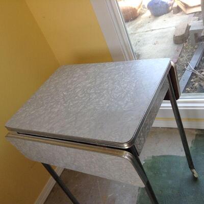 grey Formica with chrome drop leaf table on wheels