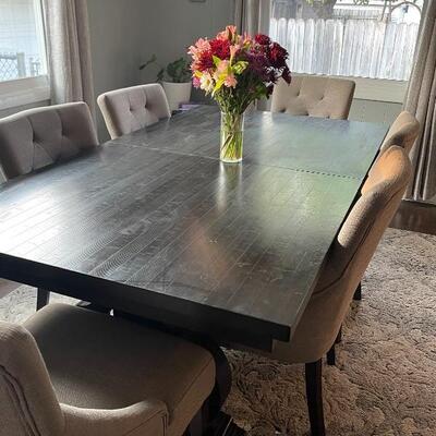 Farmhouse Dining Table and 6 tufted Chairs 
Table is dark brown weathered and chairs are taupe
Price: $700