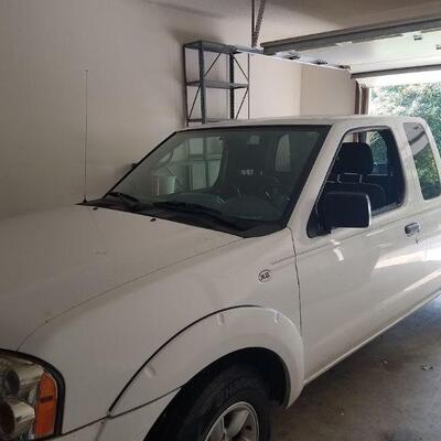 2003 Nissan Frontier XE pickup w/~162,000 miles. 2WD, four cylinder.