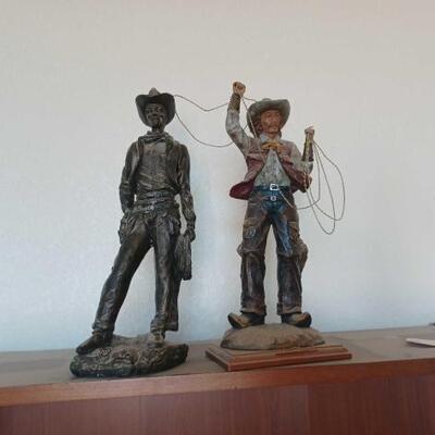 2804	

Two Cowboy Statues
Dark Statue Measures Approximately: 6