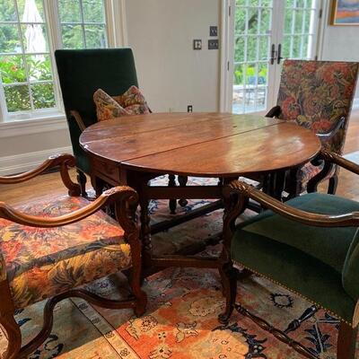 Antique Circular Table with Upholstered Chairs