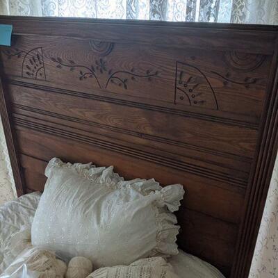 Antique bed headboard and linens