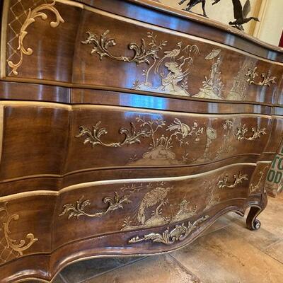 Bachelor's chest with decorative gesso detailing, signed by the artist.