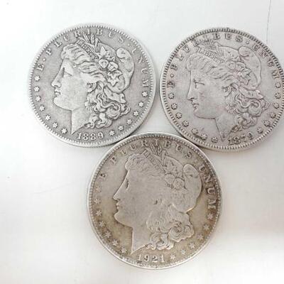#1558 â€¢ 3 1879-1921 Morgan Silver Dollars
