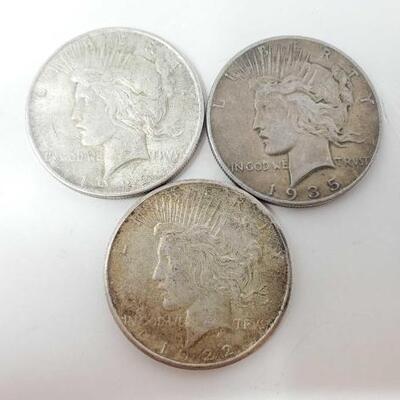#1554 â€¢ 3 1922-1935 Silver Peace Dollars
