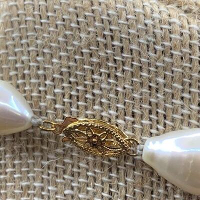 Single Strand Hand Knotted Baroque Pearl Necklace
with 14 Karat Gold Clasp