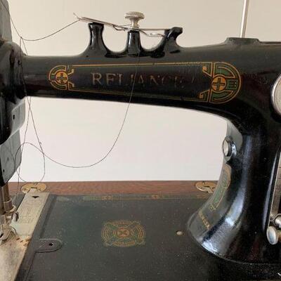 Antique Reliance treadle sewing machine and antique sewing cabinet in wonderful condition!  