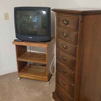 tv stand, tv and chest of drawers