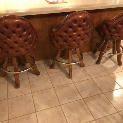 (3) brown leather bar stools | Swivel 360 degrees
23