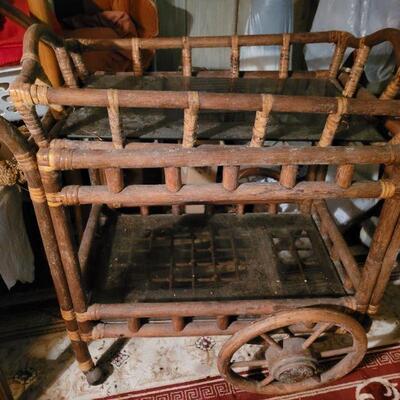 This is a tea cart made out of wood, even the wheels