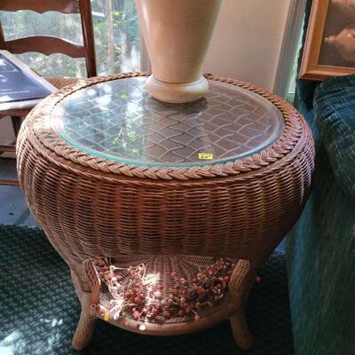 Nice wicker end table with a glass top, see matching sofa table