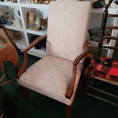 One of two nice looking arm chairs in better than good condition