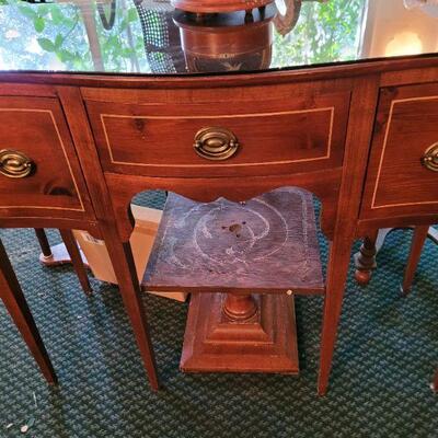 Very nice desk with a glass on the top to protect the finish. Two doors and one drawer