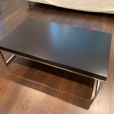 Black coffee table 12 inches high and 40 inches long and 24 inches deep