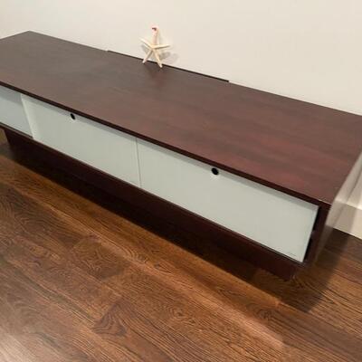 white and brown cabinet 71 long x 28 deep and 20 inches high. The front has tempered glass