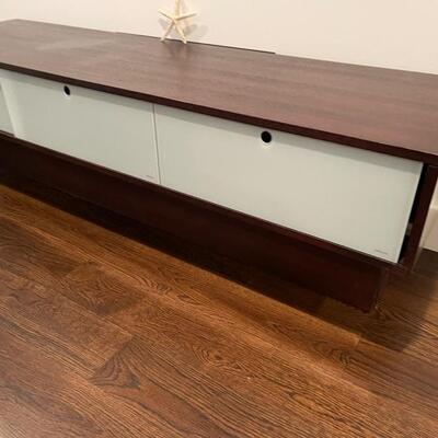 white and brown cabinet 71 long x 28 deep and 20 inches high. The front has tempered glass